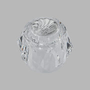 Clear acrylic knob handle with spiral ridge pattern and Delta branding on top.