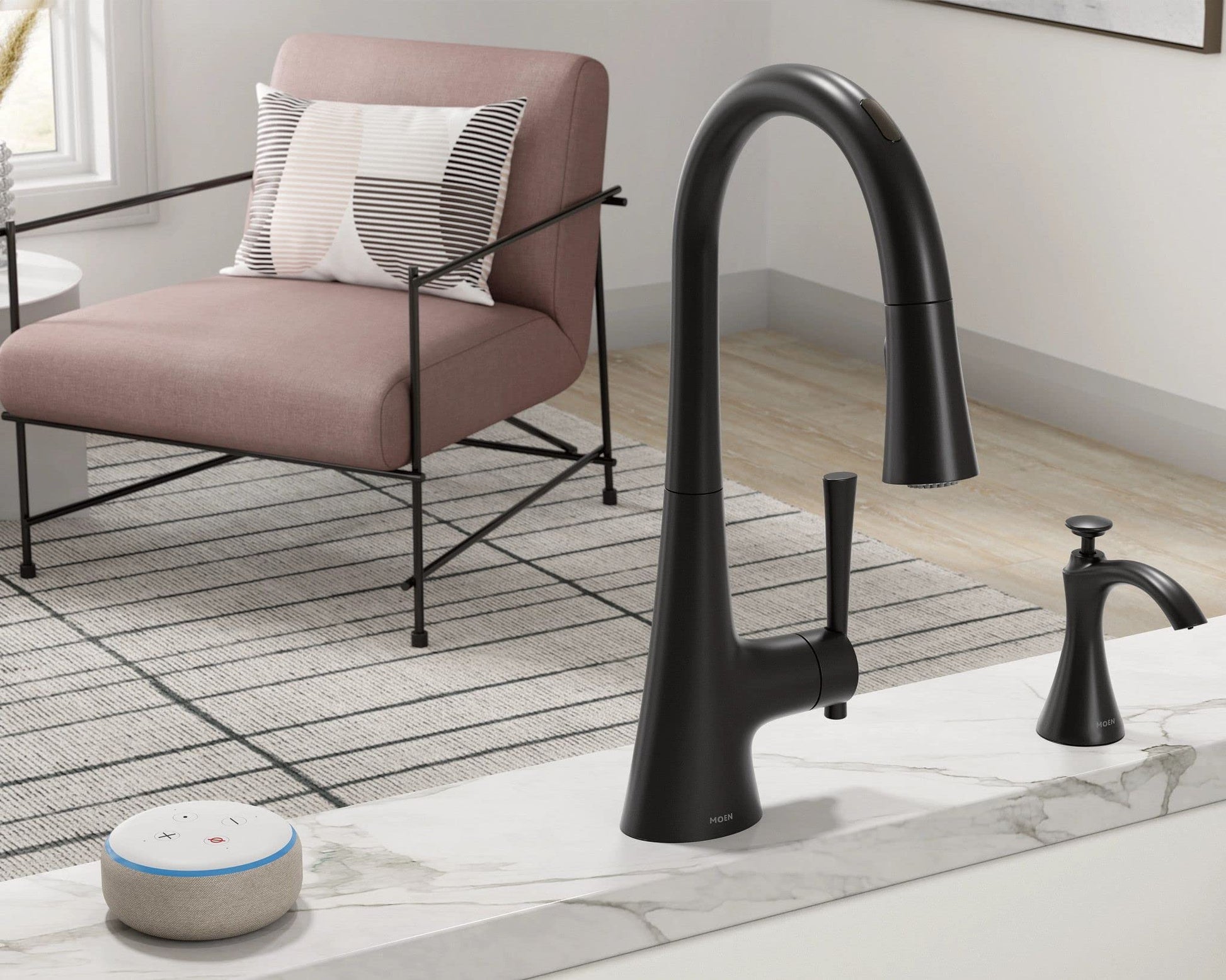 Black transitional kitchen sink faucet with matching soap dispenser on marble countertop, dispensing bottle visible.