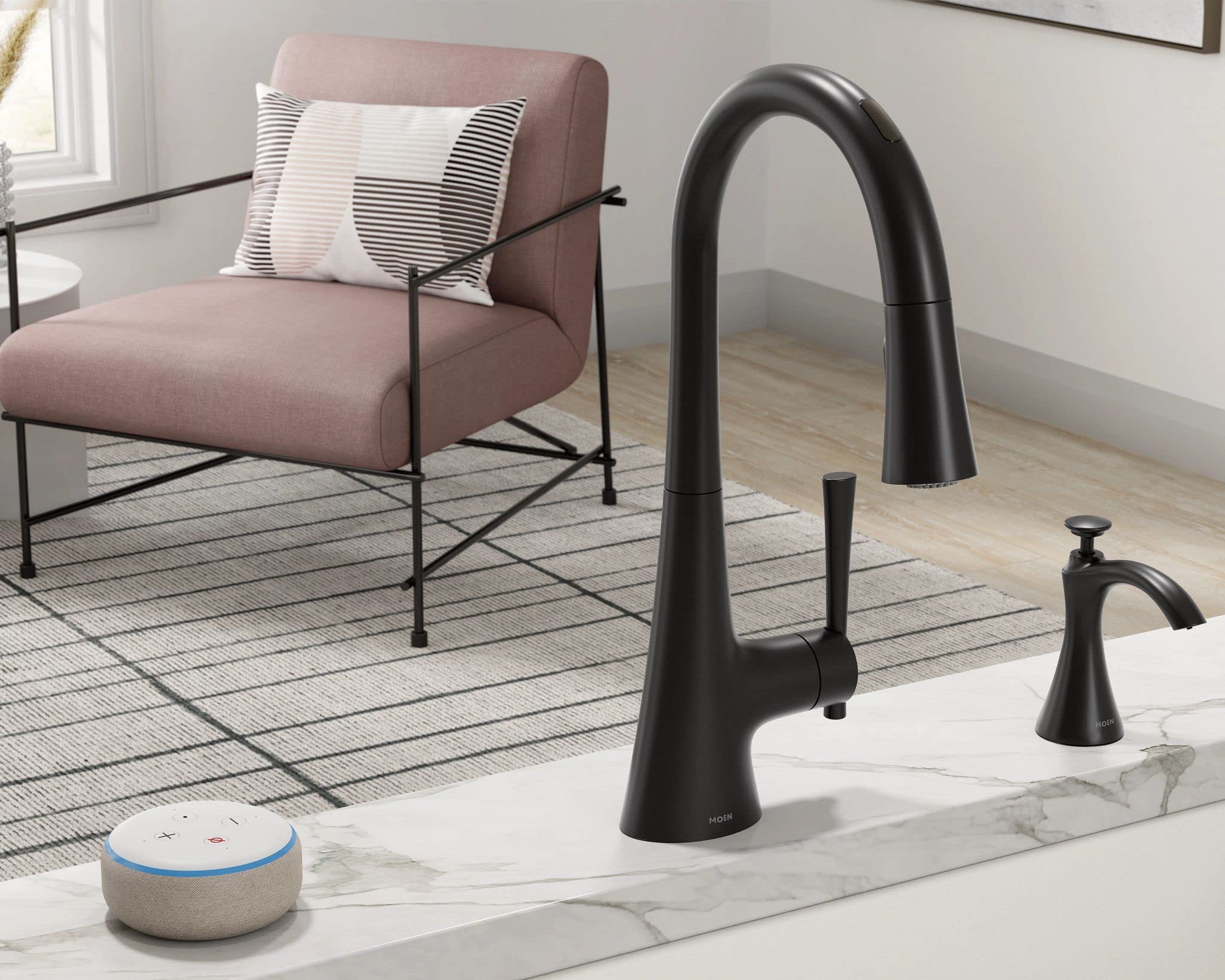 Black transitional kitchen sink faucet with matching soap dispenser on marble countertop, dispensing bottle visible.