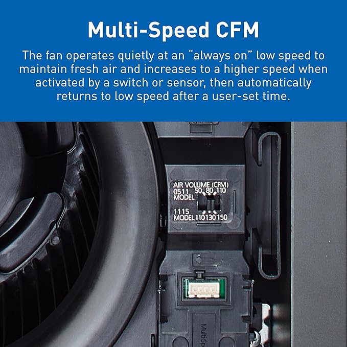 Close-up of Panasonic WhisperGreen ventilation fan showing internal motor, CFM specifications label, and green circuit board 