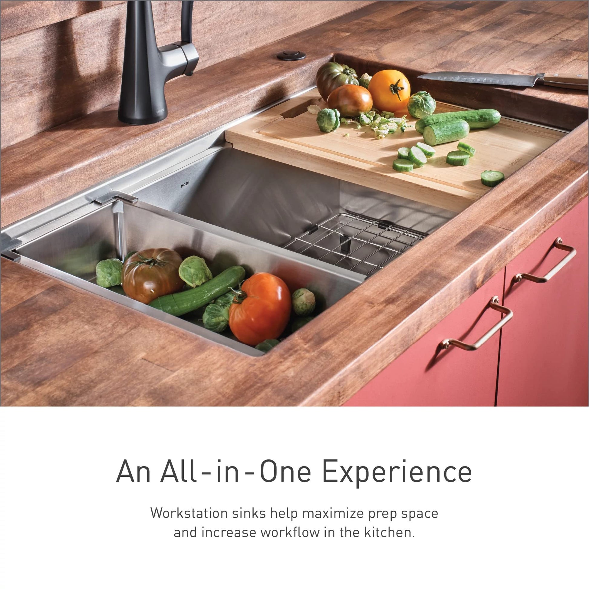 Stainless steel undermount sink with wooden cutting board, metal drying rack, and vegetables in prep compartment.