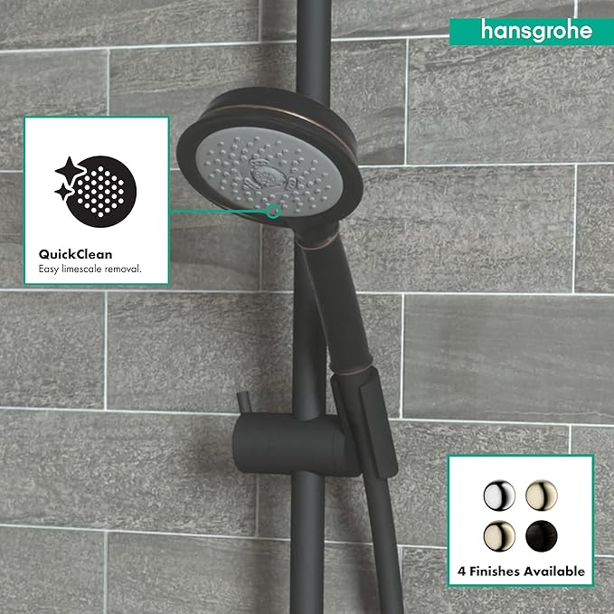 Rubbed bronze round shower head with perforated jets mounted on vertical pole against tiled shower wall.