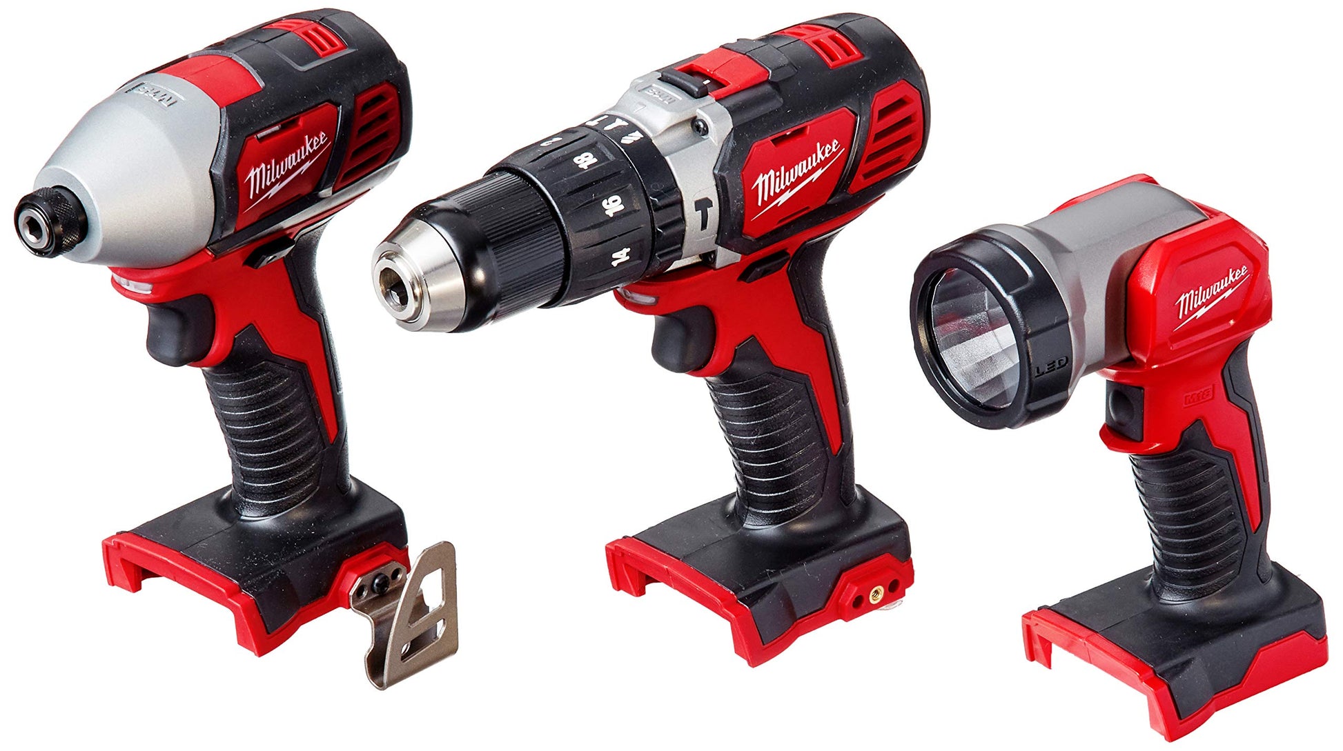 Milwaukee M18 cordless combo kit with red and black impact driver, drill, and work light.