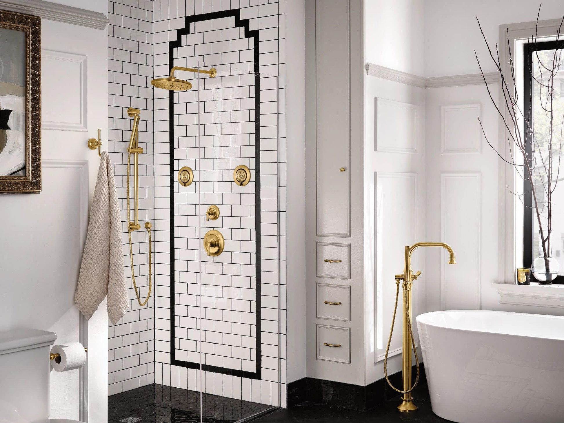 Brushed gold handheld showerhead with 30-inch slide bar and metal hose mounted on tiled shower wall.