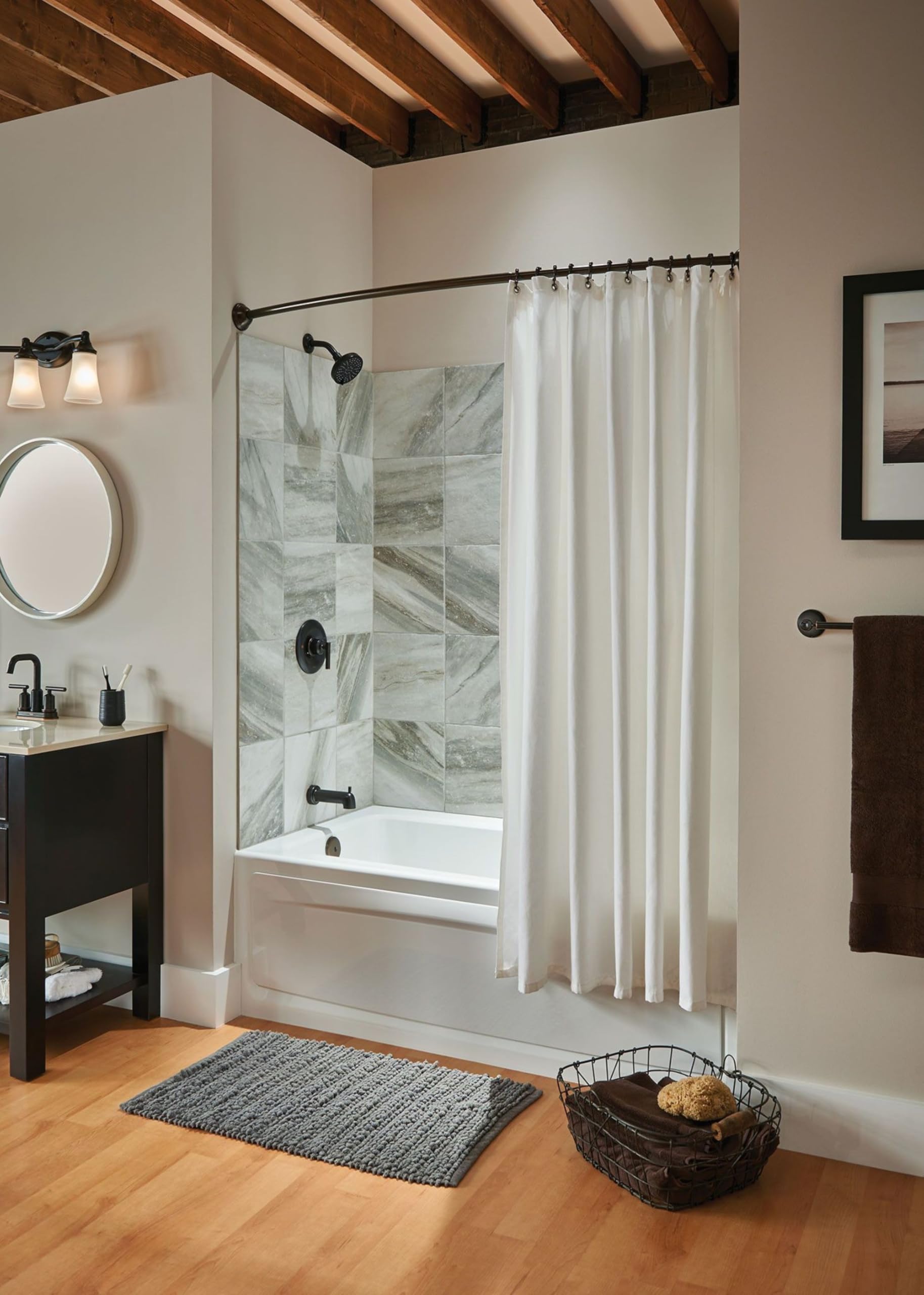 Oil-rubbed bronze vanity fixture with three frosted glass lights mounted above bathroom sink.