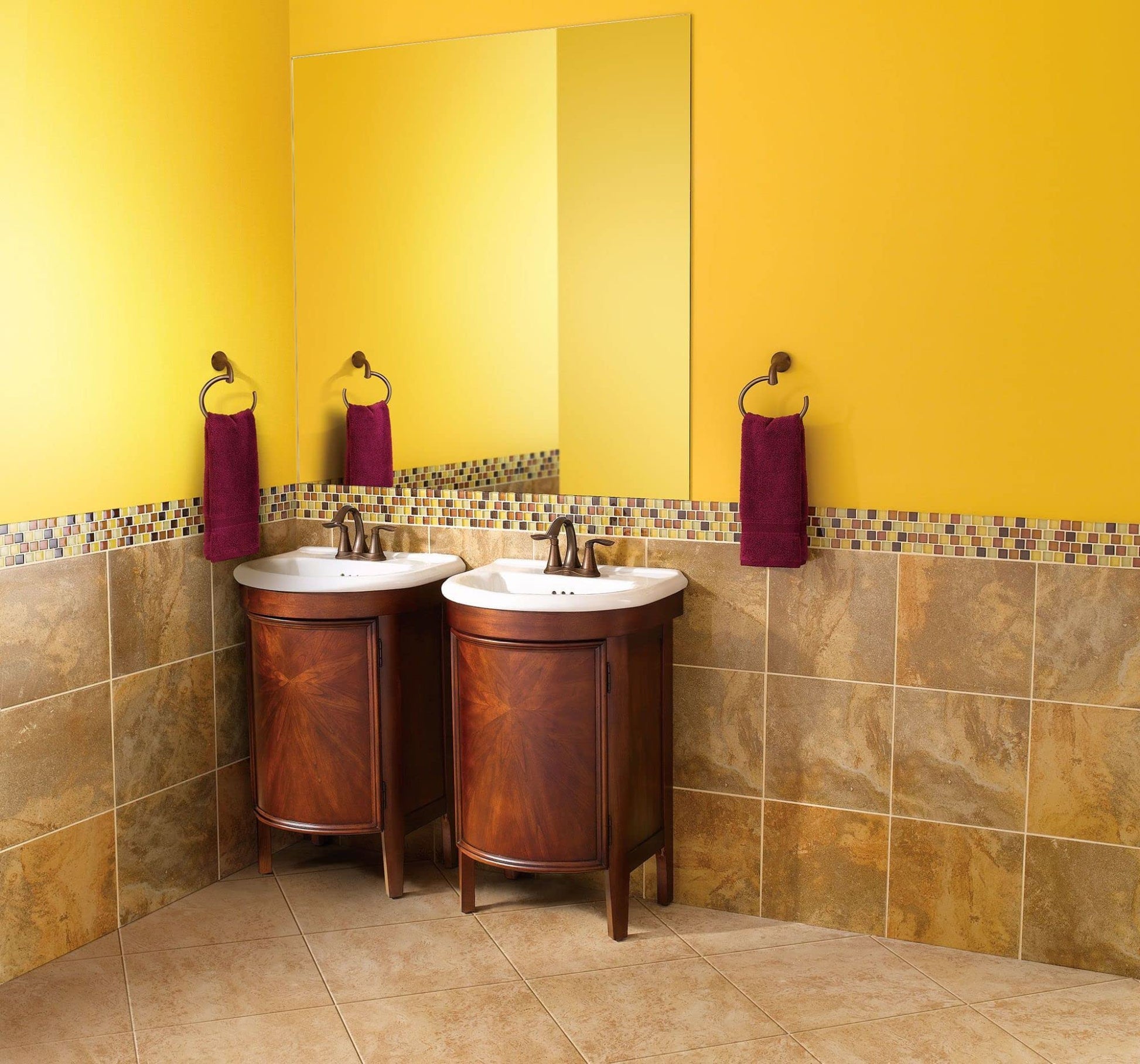 Oil rubbed bronze towel ring with circular design mounted on bathroom wall above sink vanity.