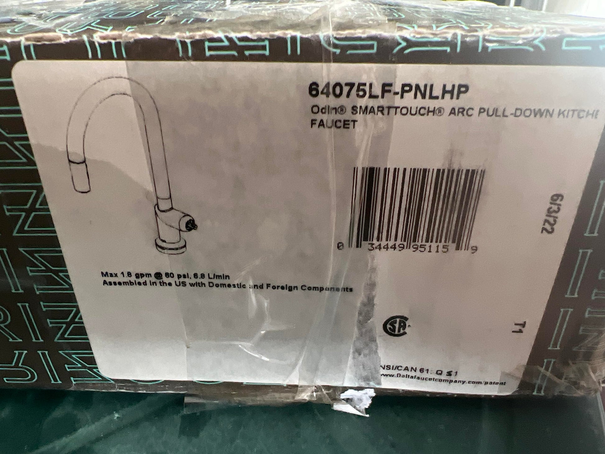 Polished nickel pull-down kitchen faucet with arched spout and touchless activation in retail packaging.