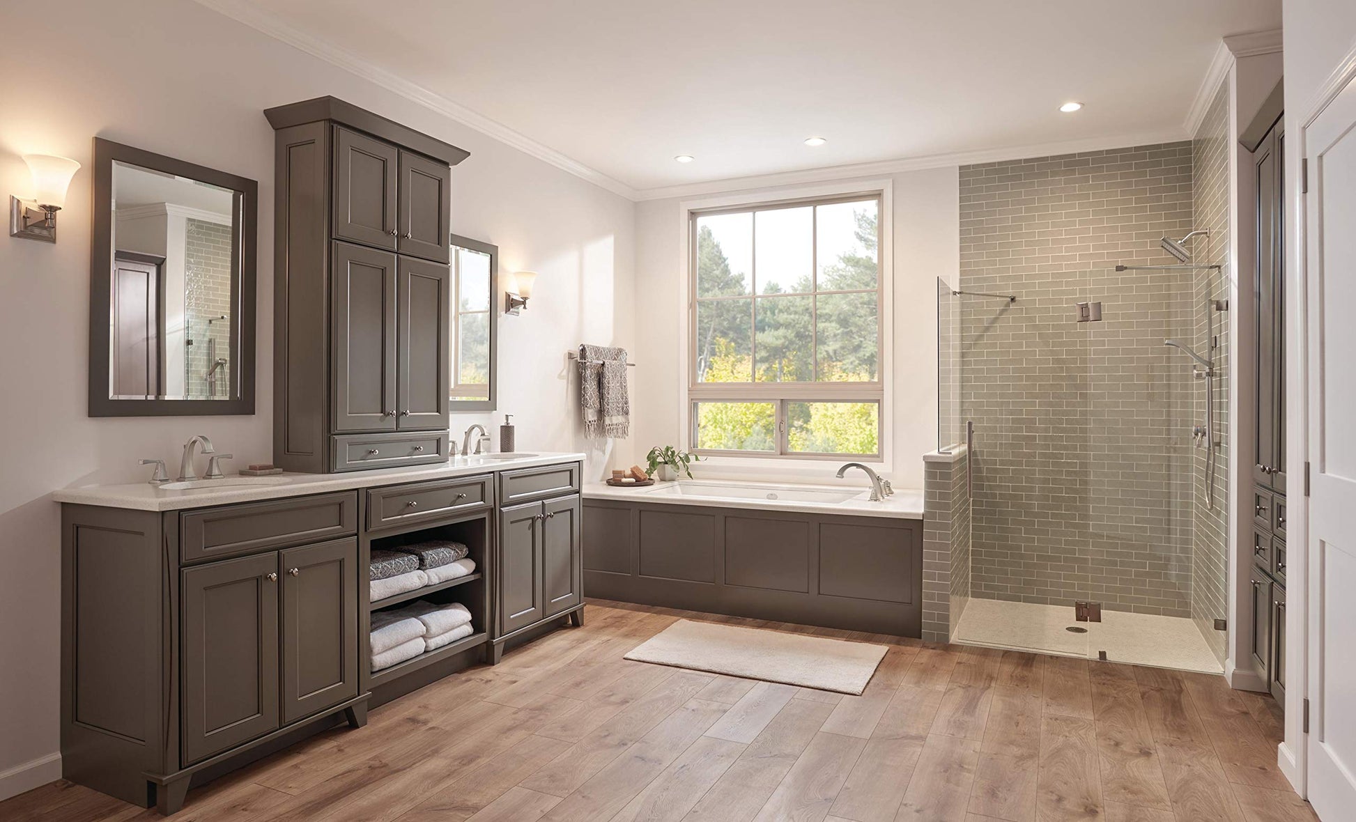 Chrome Delta Dryden diverter trim with three-way control mounted on bathroom wall above soaking tub.