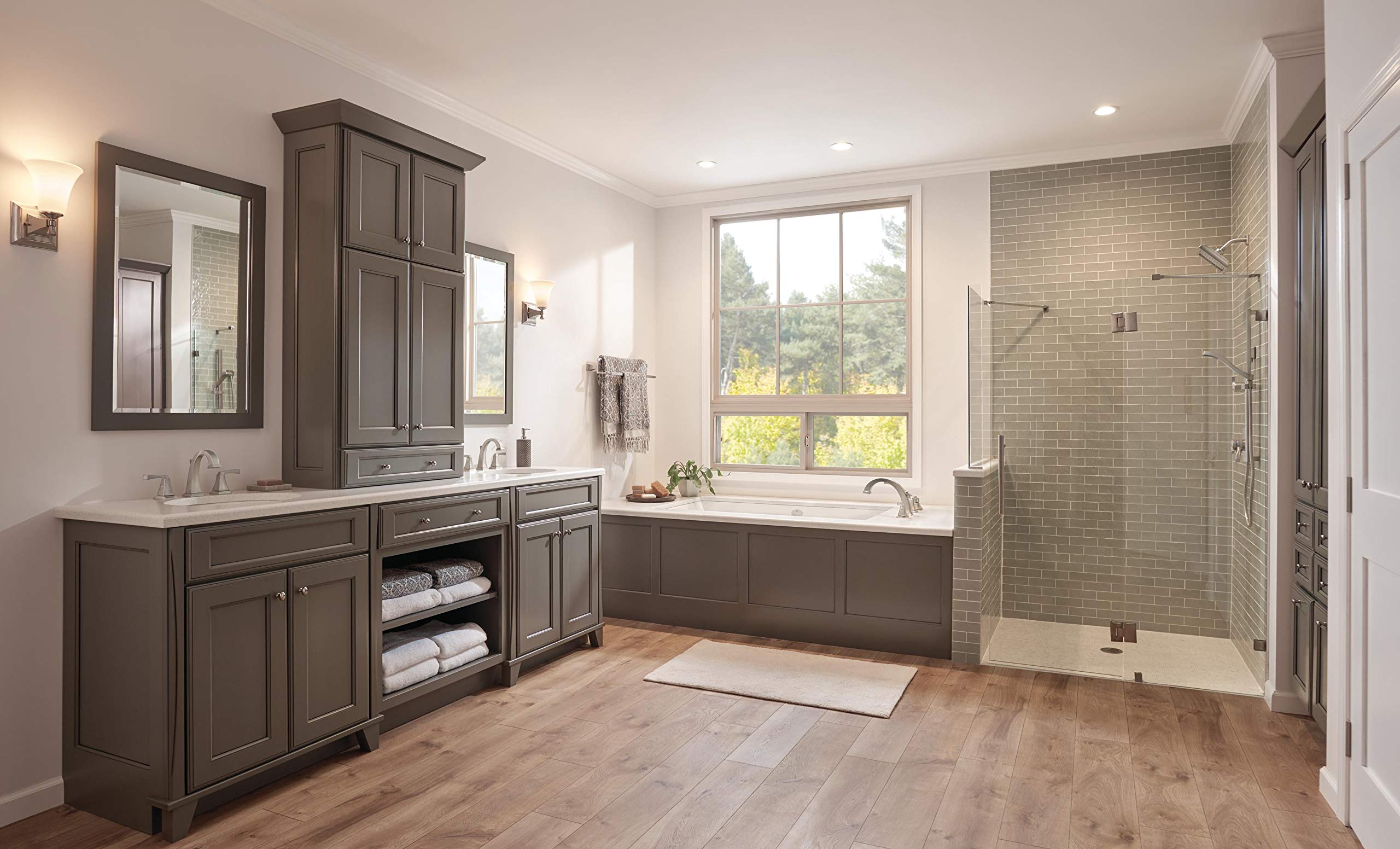 Chrome Delta Dryden diverter trim with three-way control mounted on bathroom wall above soaking tub.