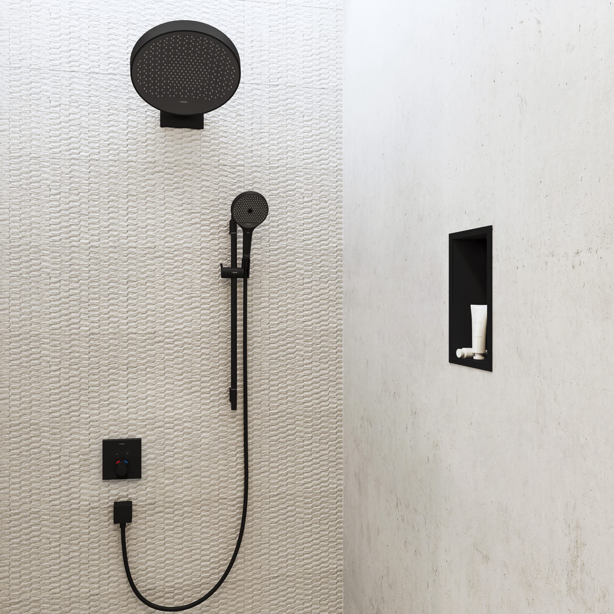 Matte black rectangular wall niche with integrated frame installed on bathroom wall next to shower fixtures.