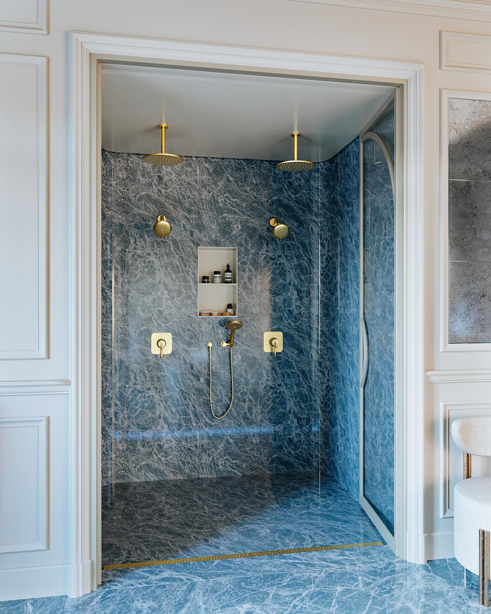 Polished chrome shower hose with curved design connecting to wall-mounted fixture in marble-lined shower enclosure.
