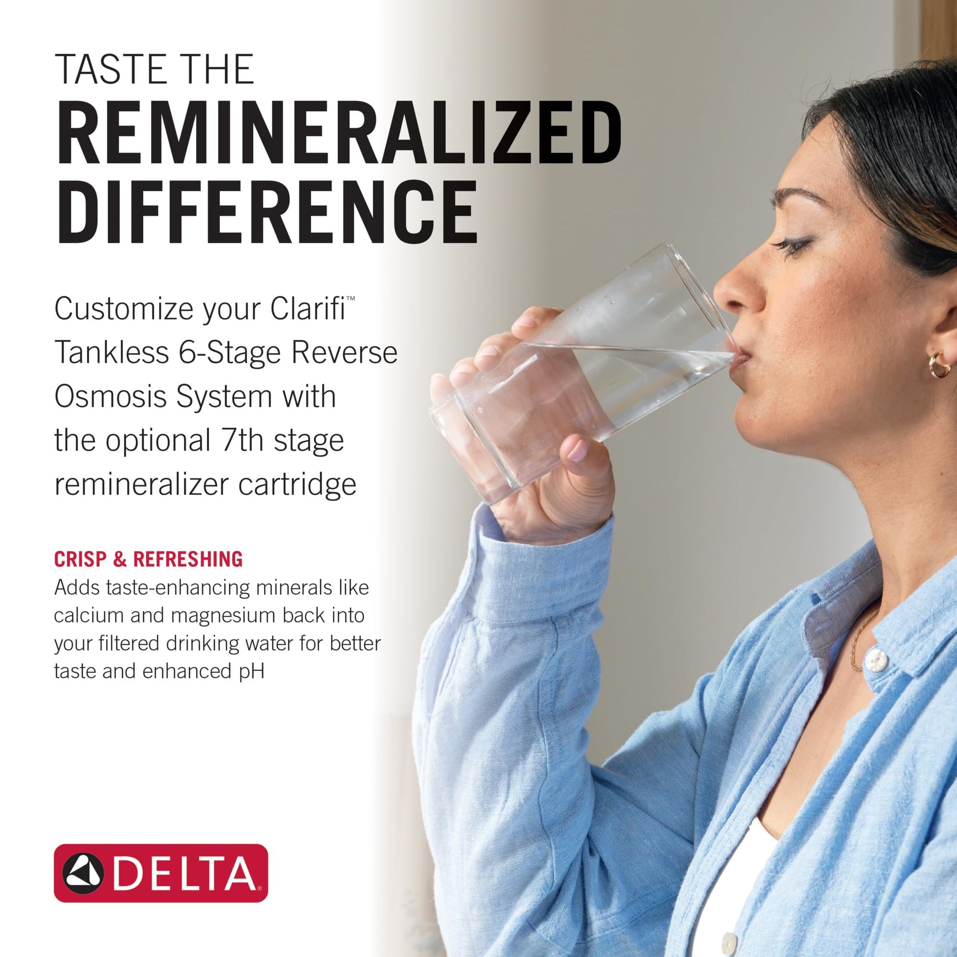 Woman in blue shirt drinking water from clear glass.