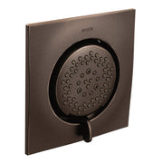 Oil rubbed bronze square body spray with perforated circular showerhead and control lever mounted on flat wall plate.
