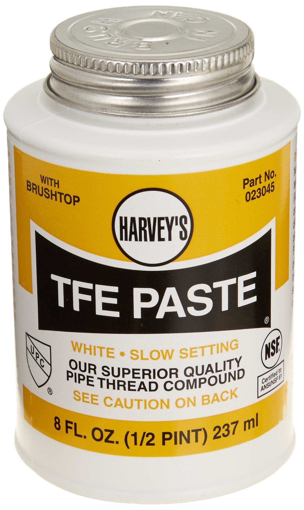 White plastic container with metal screw-on cap labeled Harvey's TFE Paste, 8 fl oz, with yellow and black label and brush ap