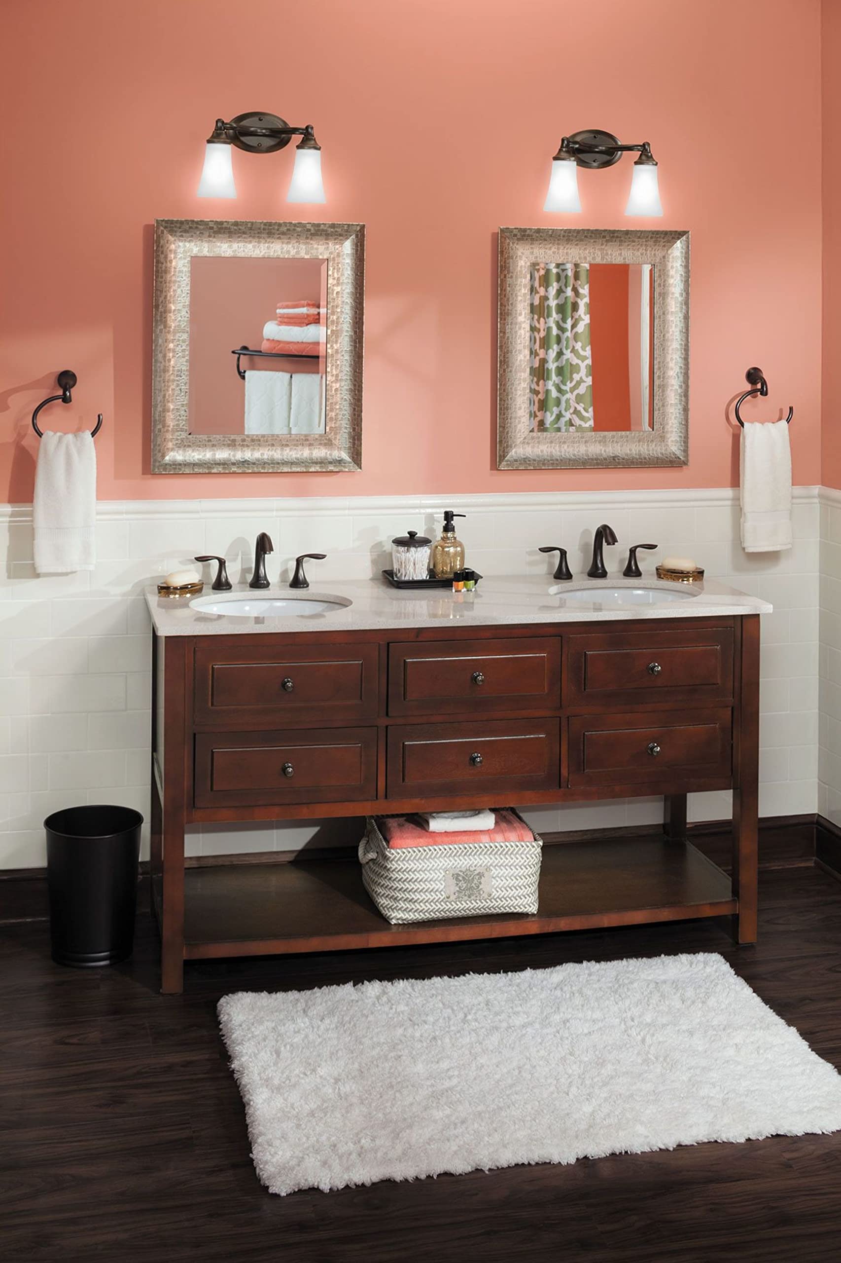 Oil rubbed bronze towel ring mounted on bathroom wall beside vanity sink.