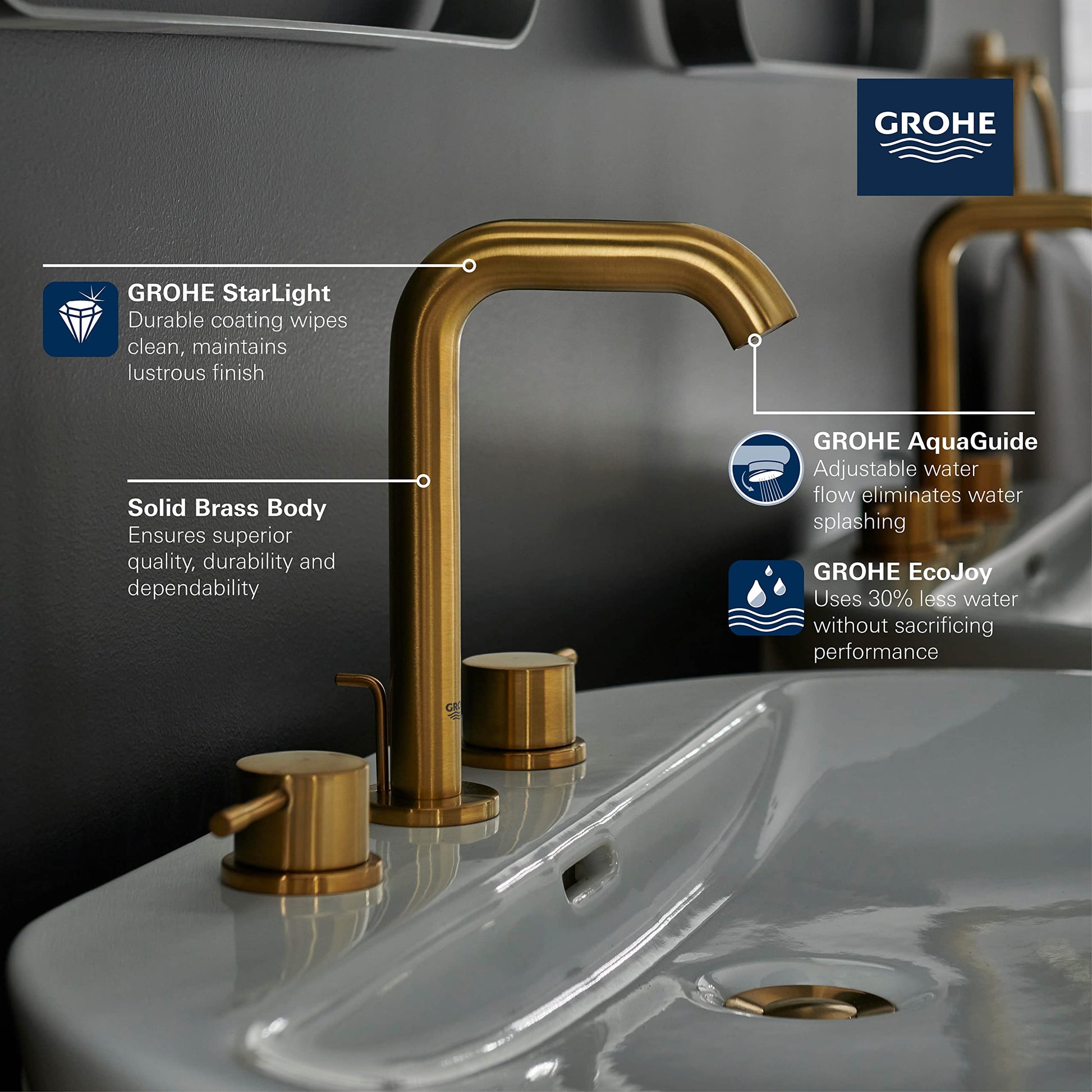 Grohe Essence brushed gold widespread bathroom faucet with high arc spout and two cylindrical handles mounted on sink.