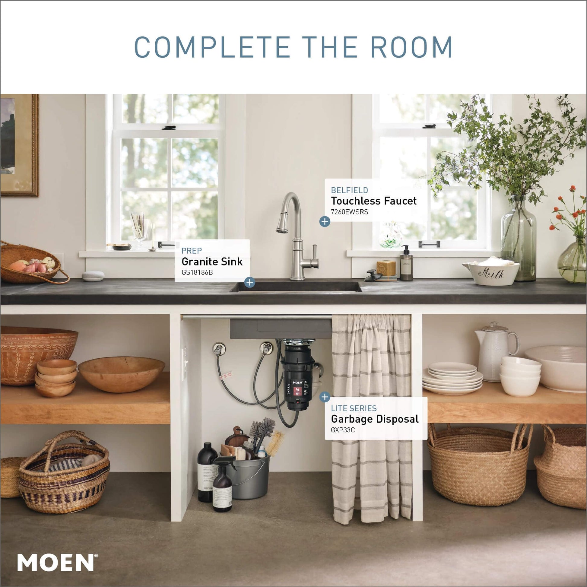 Stainless steel touchless kitchen faucet with single handle and pulldown spout mounted above dark countertop sink.
