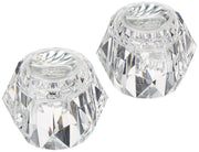 Two clear acrylic knob handles with faceted geometric design and Delta branding on top.