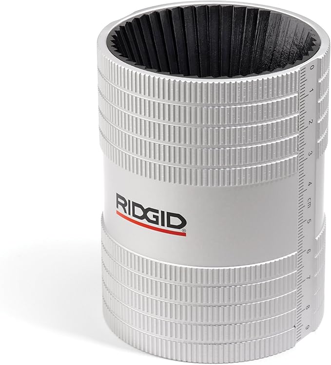 RIDGID pipe reamer with metal cutting blades inside cylindrical body, size markings on side.