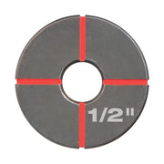 Circular stainless steel die with 1/2 inch marking and red alignment lines on gray metallic surface.