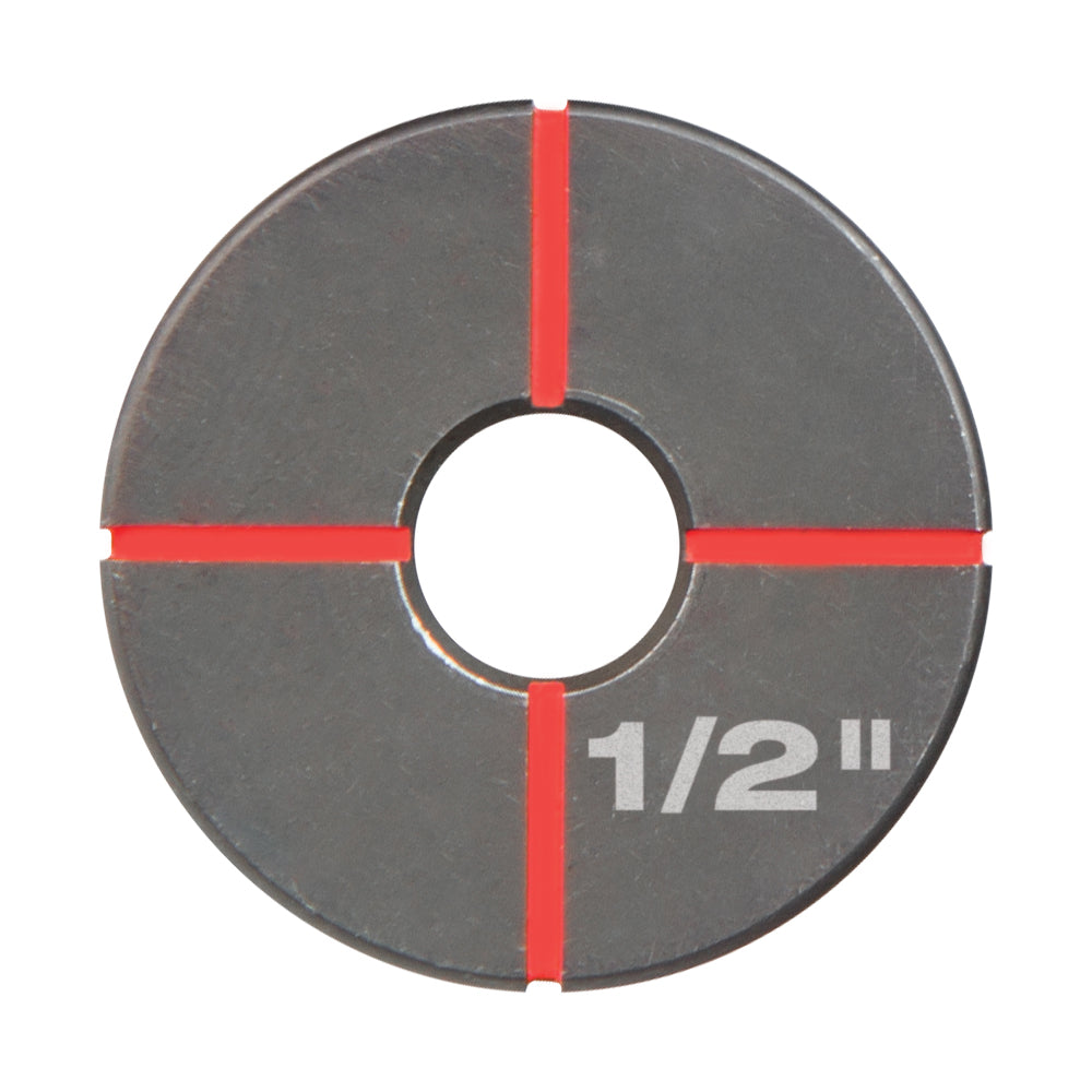 Circular stainless steel die with 1/2 inch marking and red alignment lines on gray metallic surface.