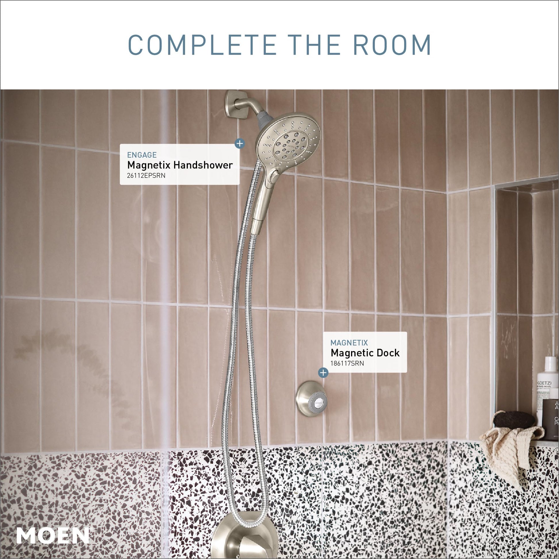 Brushed nickel magnetic cradle dock mounted on shower wall below handheld showerhead.