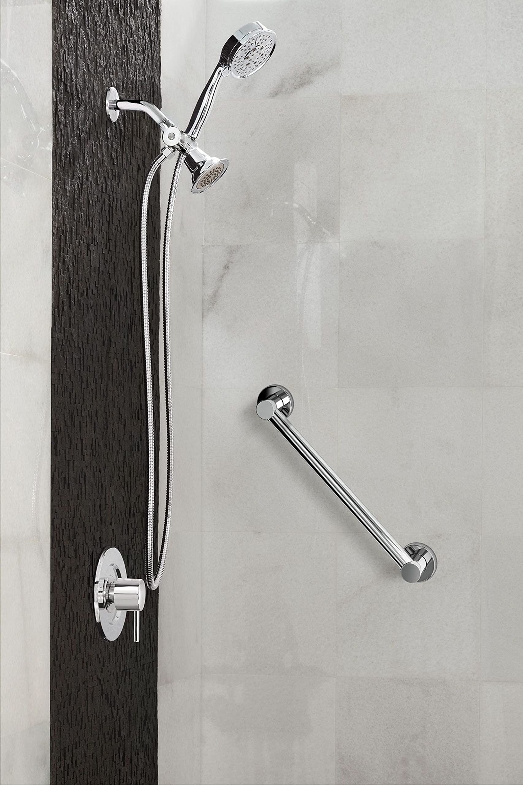 Chrome shower faucet system with handheld showerhead, wall-mounted control valve, and grab bar on tile wall.