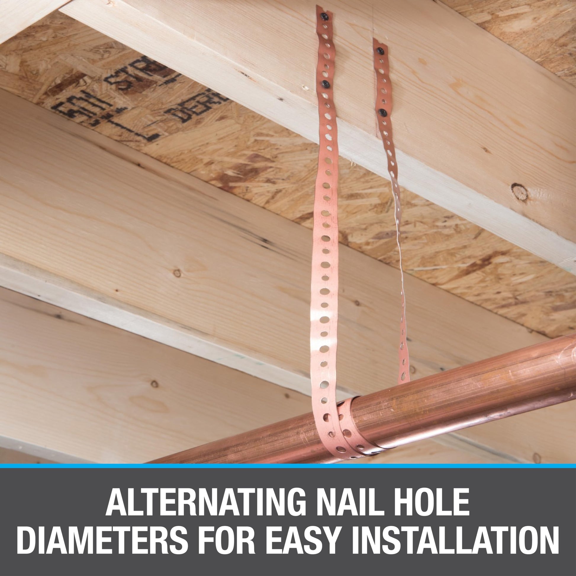 Steel pipe securing strap with alternating nail holes securing copper pipe to wooden ceiling joists.
