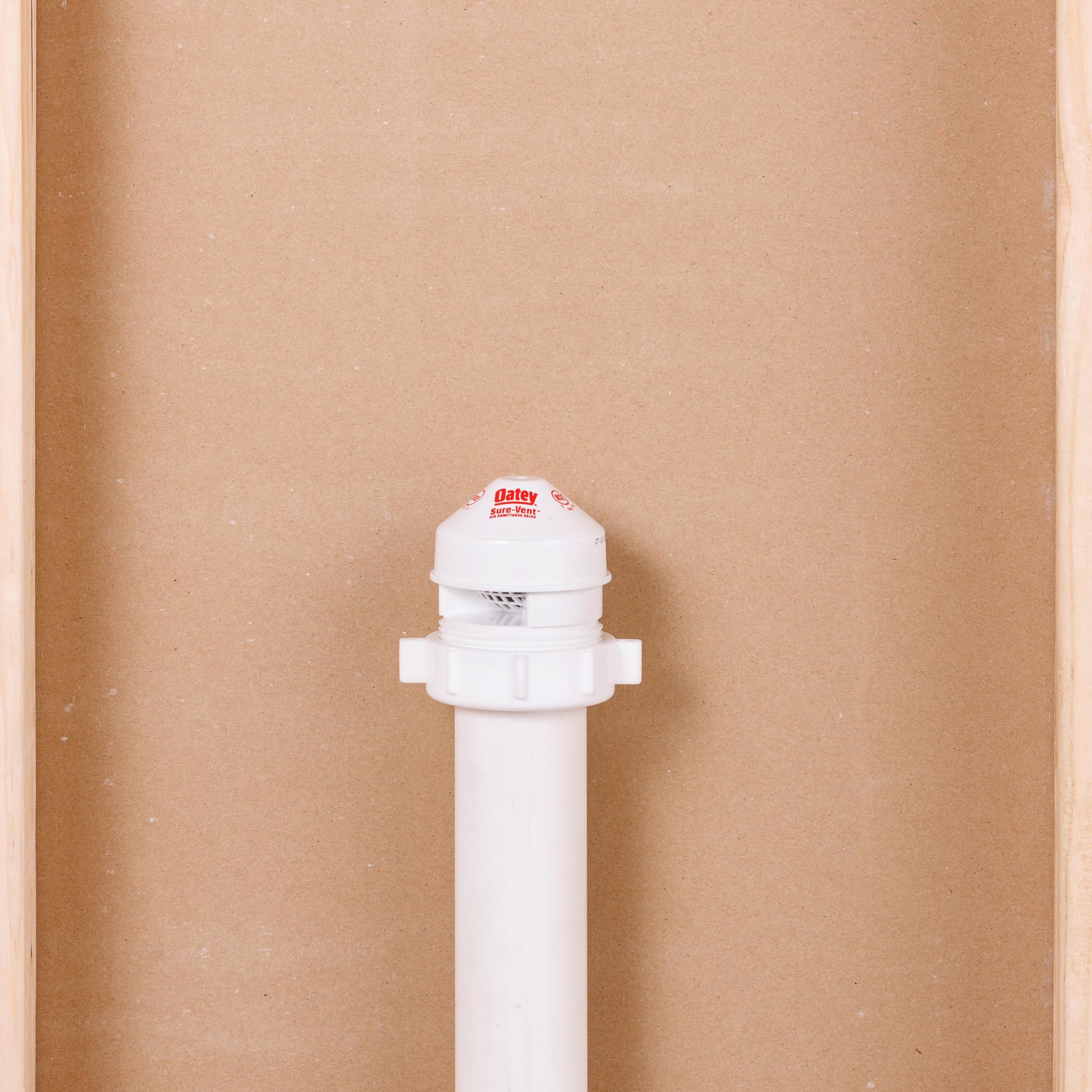 White plastic air admittance valve with threaded connector and domed cap featuring Oatey branding.
