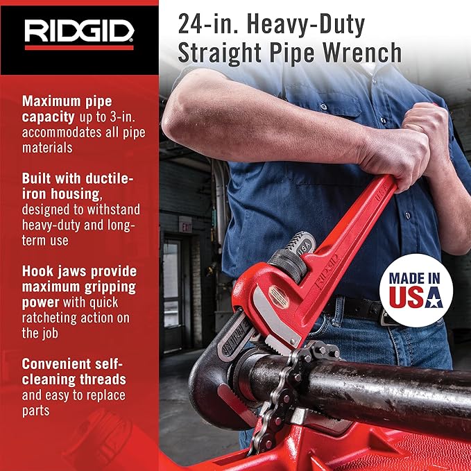 Red straight pipe wrench with ductile-iron housing held by person gripping dark pipe.