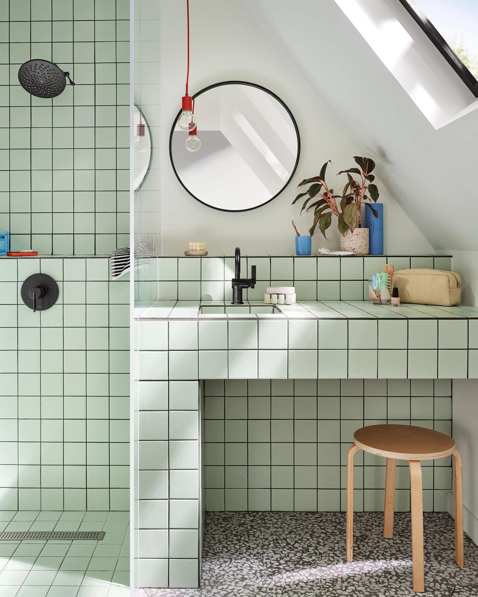 Matte black single-handle bathroom faucet with curved spout mounted on white sink counter.