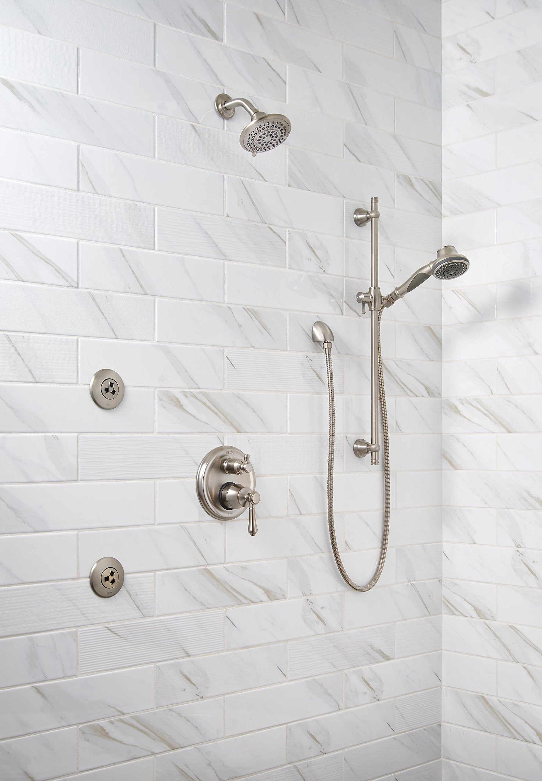 Stainless steel shower system with fixed overhead showerhead, handheld showerhead on sliding bar, and valve trim mounted on m