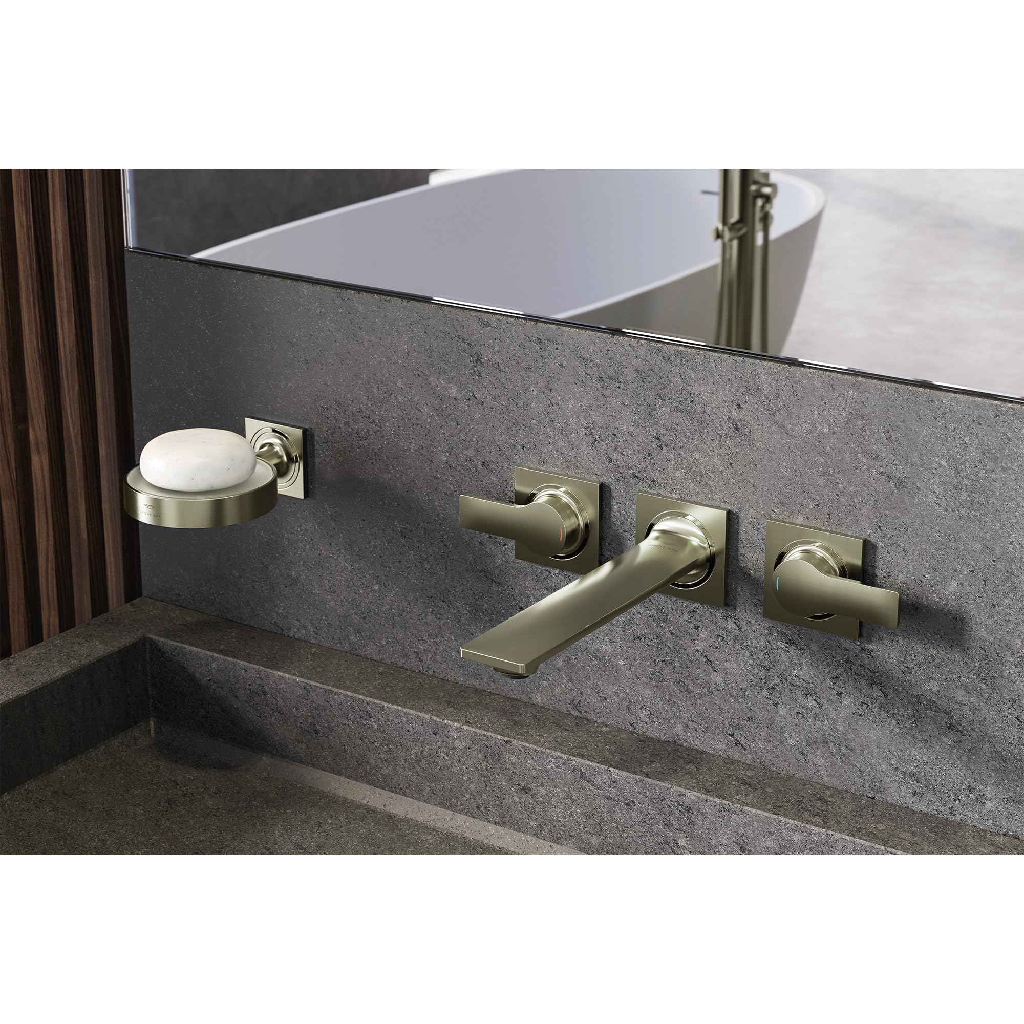 Brushed gold wall-mounted faucet with two handles and spout installed on gray stone sink backsplash.