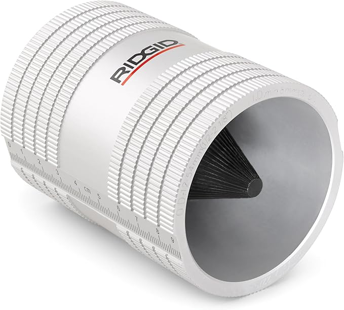 RIDGID pipe reamer with white cylindrical body, ridged grip bands, and black internal cutting blades visible inside opening.