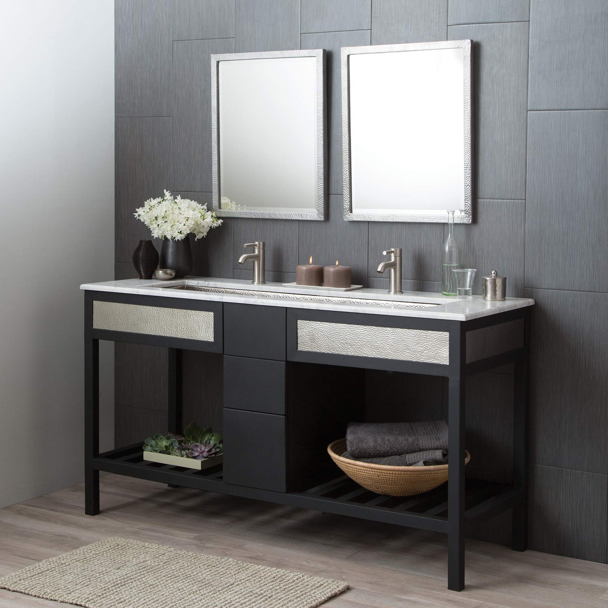 Rectangular bathroom mirror with white textured frame, displayed above black vanity in bathroom setting.