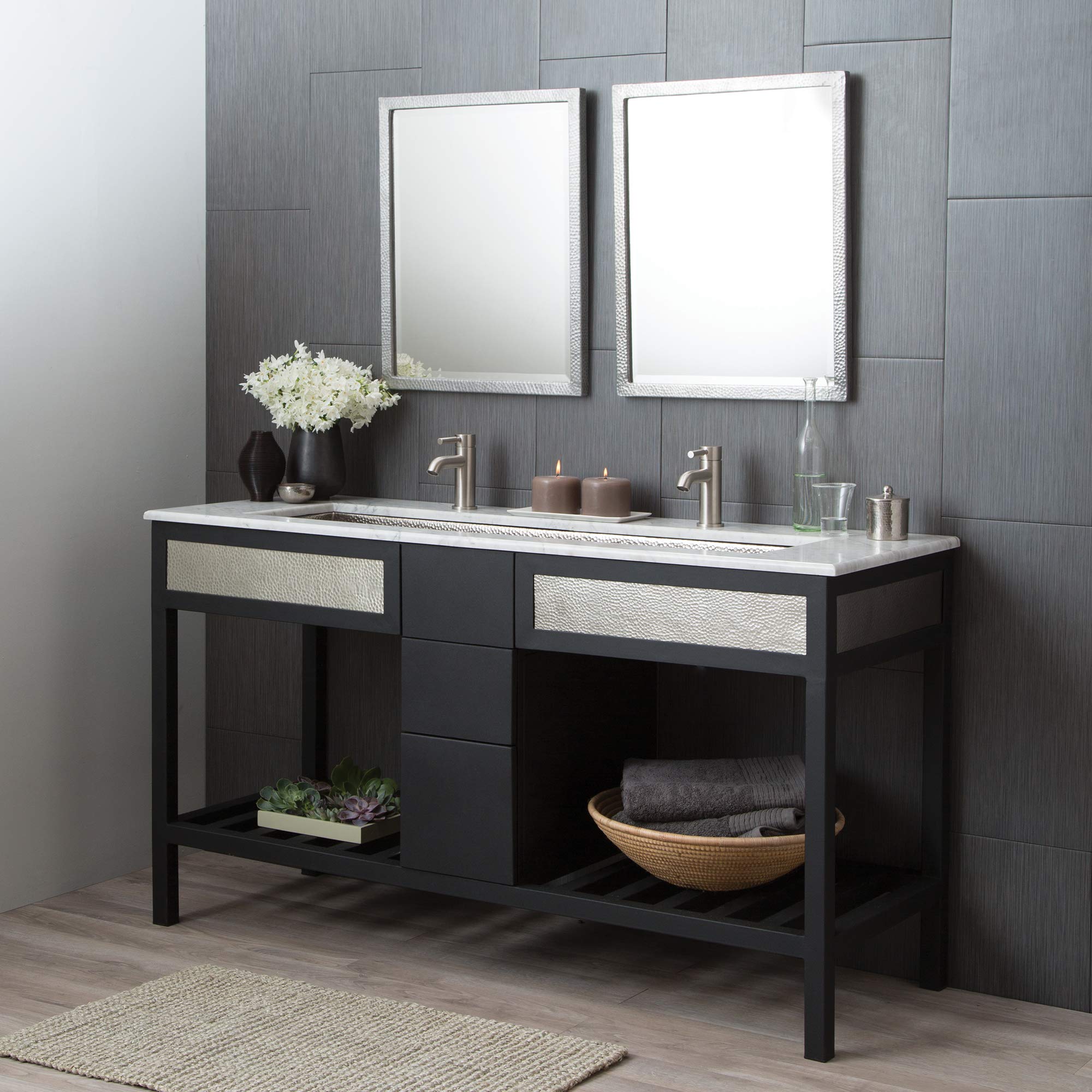 Rectangular bathroom mirror with white textured frame, displayed above black vanity in bathroom setting.