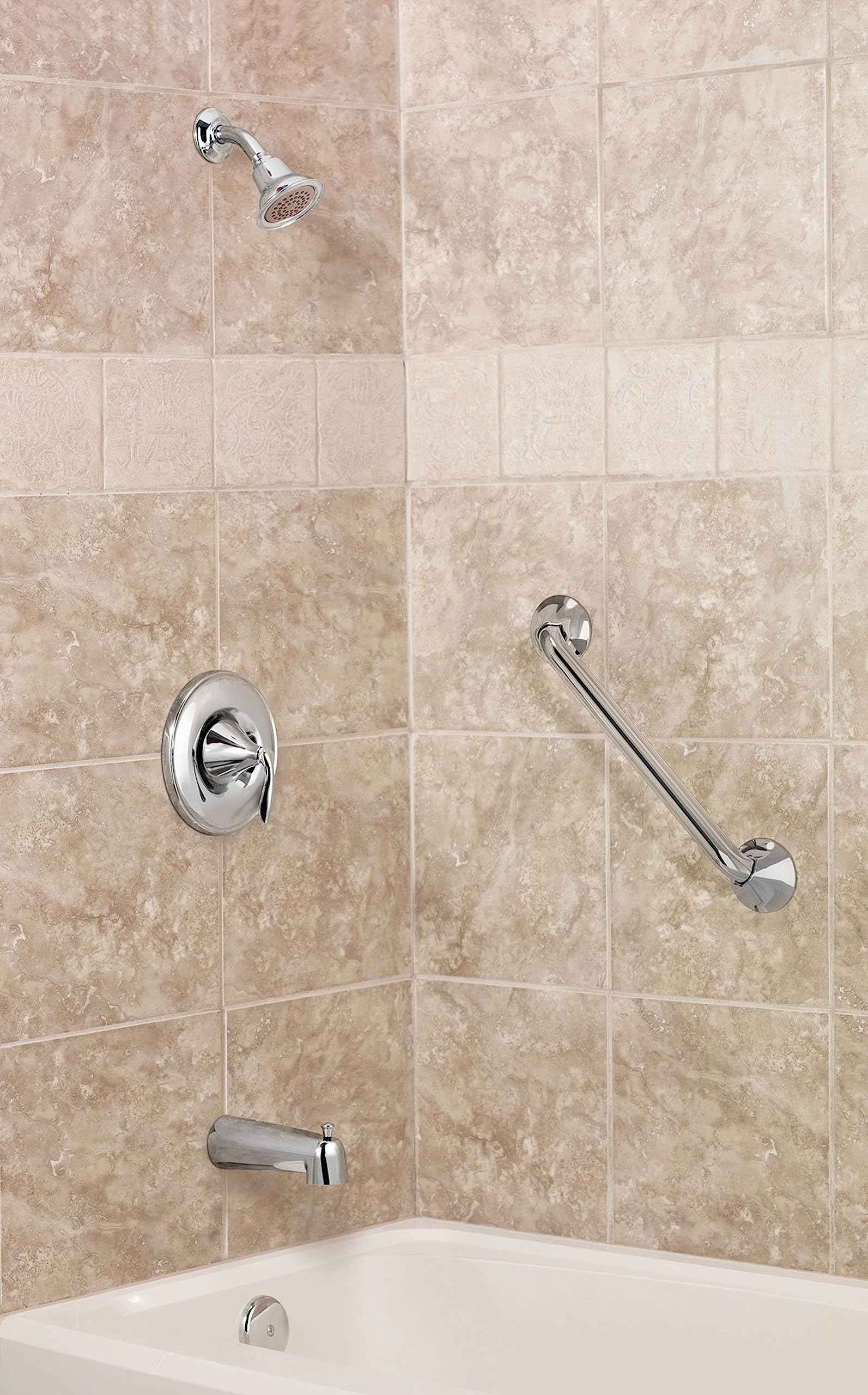 Chrome grab bar mounted horizontally on beige tile bathroom wall next to shower fixtures.