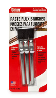 Three paste flux brushes with black bristles and metallic handles in clear plastic packaging.