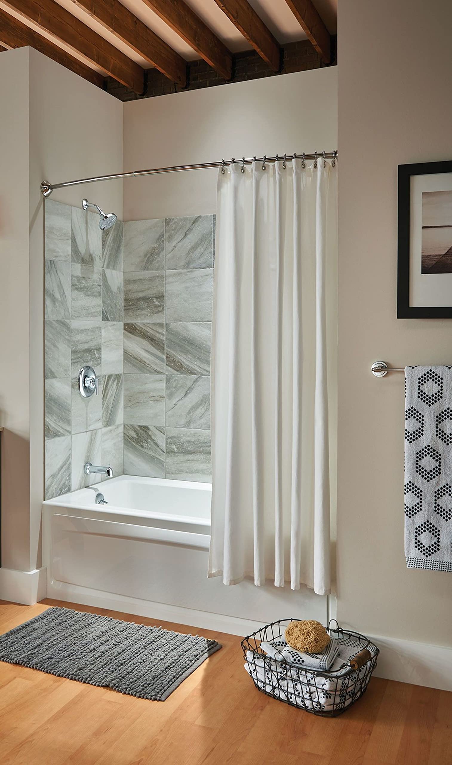 Chrome bathroom vanity fixture with three frosted glass lights mounted above sink in bathroom setting.