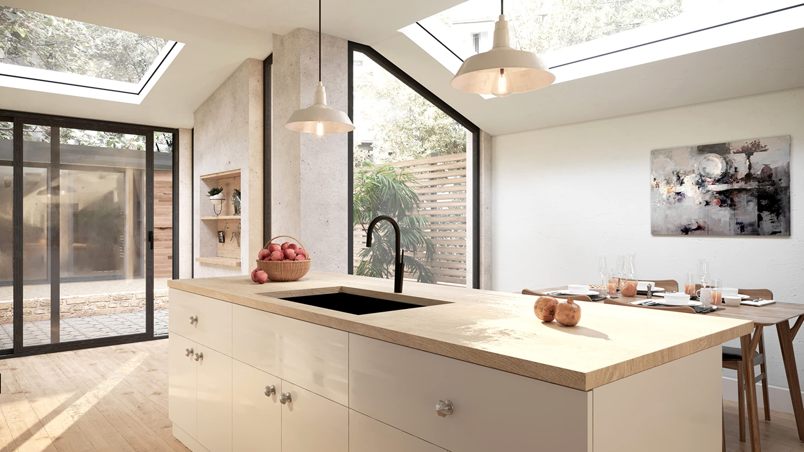 Black stainless steel single bowl kitchen sink installed in white cabinetry with light wood countertop.