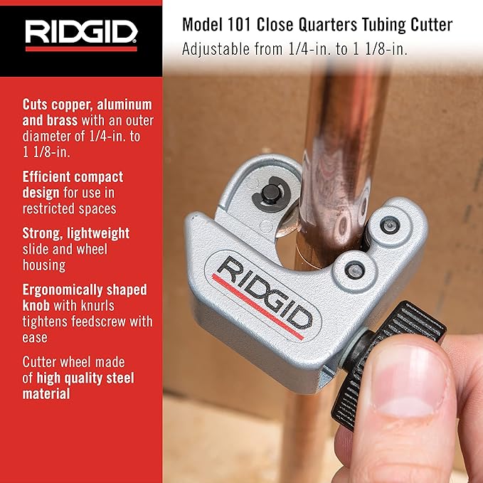 RIDGID Model 101 Close Quarters Tubing Cutter with silver metal housing held in hand against copper tubing.