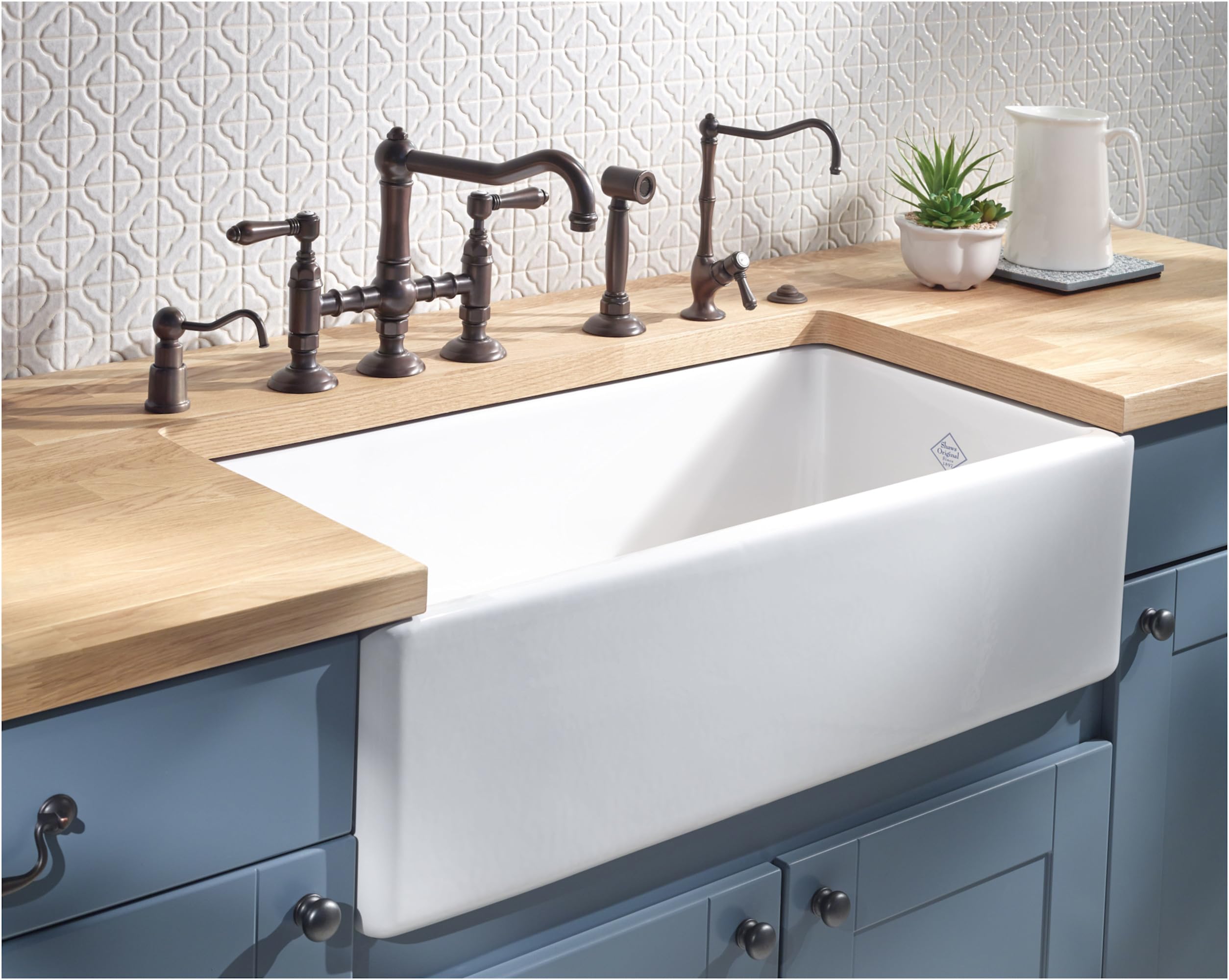 I can see this is a kitchen sink setup, but the garbage disposal air switch control box is not visible in this image. The pho