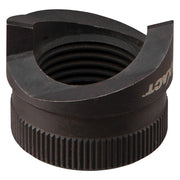 Black metal punch tool with cylindrical body, ribbed grip base, and circular opening with concentric grooves at top.
