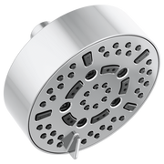 Round chrome shower head with multiple spray nozzles and control lever mounted on white cylindrical wall bracket.