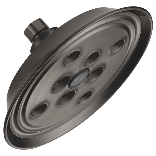 Round brushed nickel shower head with multiple spray holes and wall mount connection.