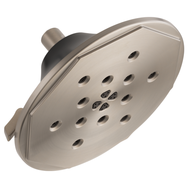 Brushed nickel round wall mount shower head with multiple spray jets and connected arm.