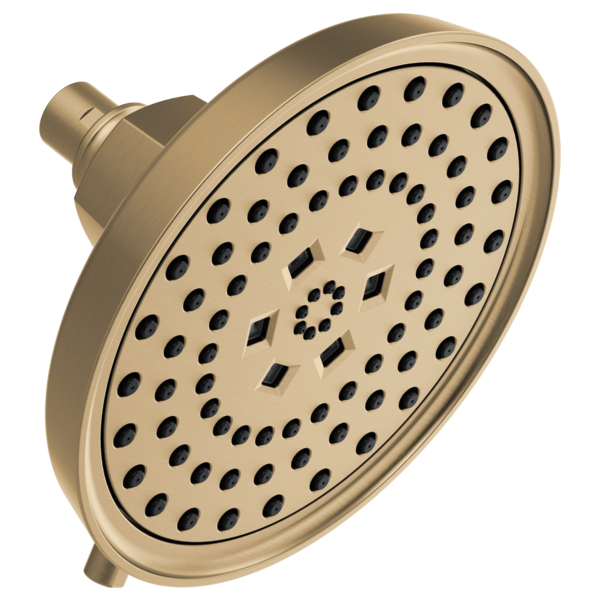 Round brushed bronze shower head with multiple spray holes and square pattern jets in center.