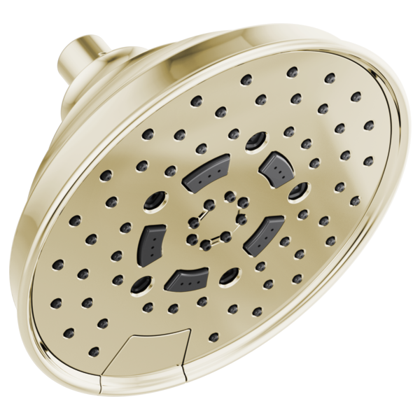 Round brushed nickel shower head with multiple spray nozzles and adjustable jet ports mounted on wall bracket.