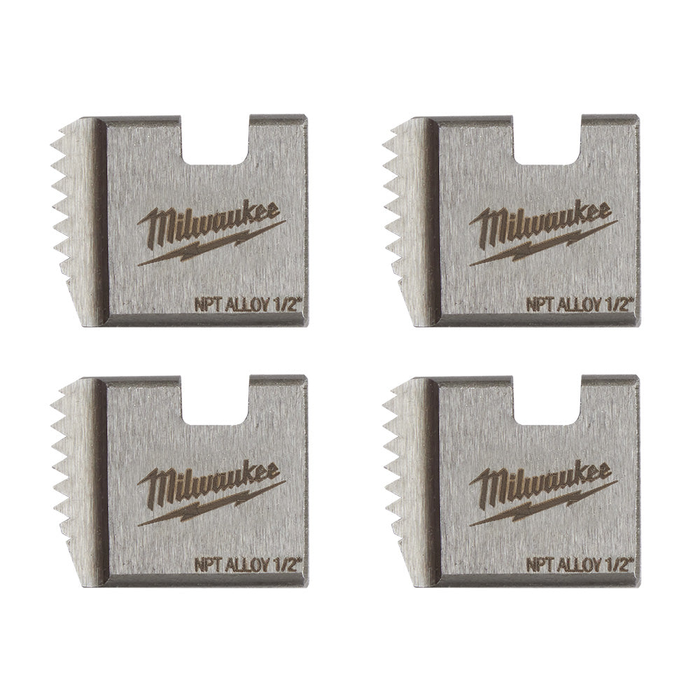 Four metal threading dies with serrated edges, Milwaukee logo and "NPT ALLOY 1/2" markings visible on each die.