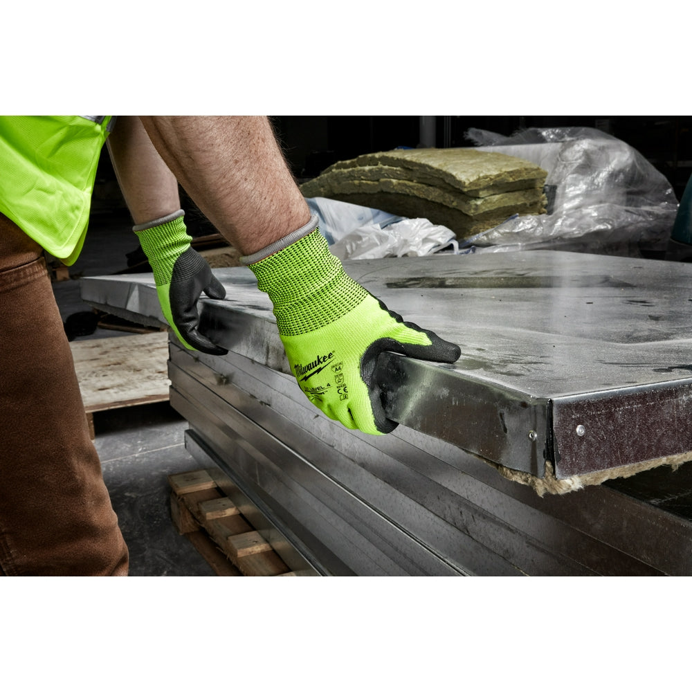 High-visibility yellow and black polyurethane-dipped work gloves with textured grip, worn while handling metal material.